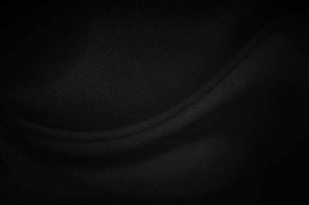 Fekete szövet lap háttér vagy textúra, elvont hullámok, puha fókusz ruha selyem fekete - Fotó, kép