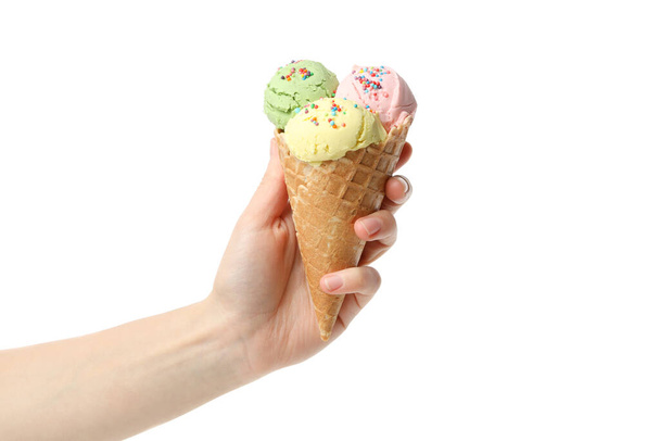 Female hand holds ice cream, isolated on white background - Photo, image
