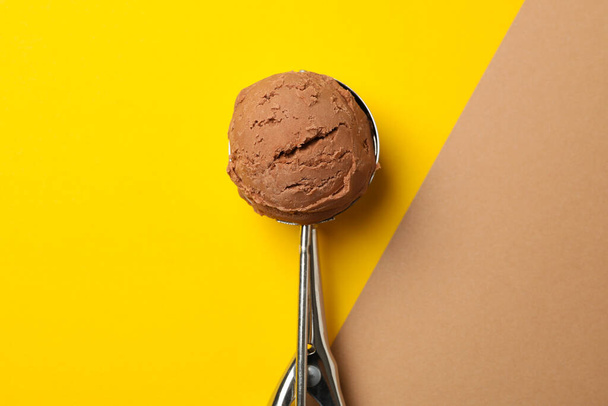 Spoon with ice cream on two tone background, space for text - Zdjęcie, obraz