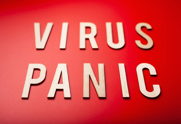 virus panic word text wooden letter on red background coronavirus covid-19 - Foto, Imagen
