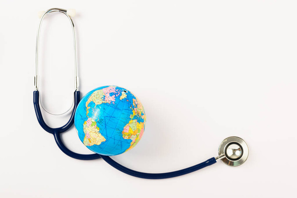 World health day concept, Stethoscope and globe on white background with copy space. Global health care - Fotó, kép