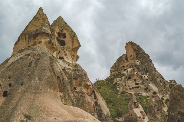 Abandoned dwellings in the rocks of volcanic tuff in Turkish Cappadocia. - Фото, изображение