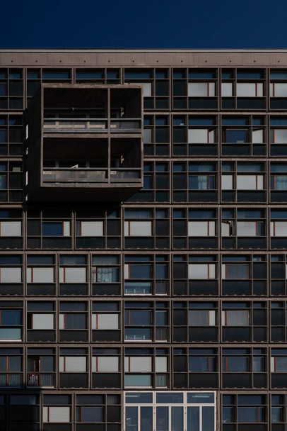 A glass panelled modern building with protruding balcony - Fotografie, Obrázek
