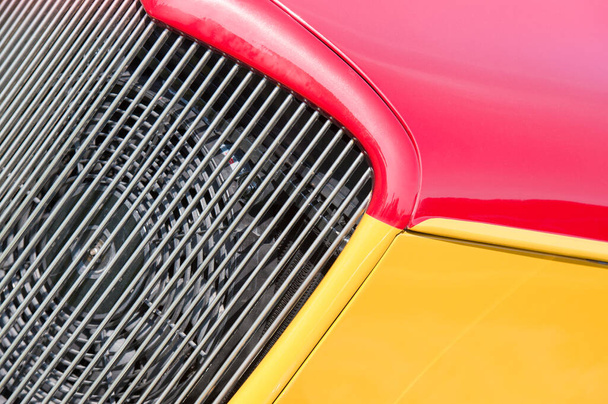 red and yellow vehicle panels next to the engine cooling fan - Photo, Image