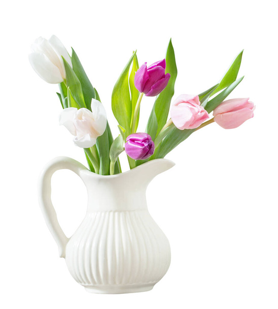 pink tulips in white ceramic jug isolated on white background - Photo, image