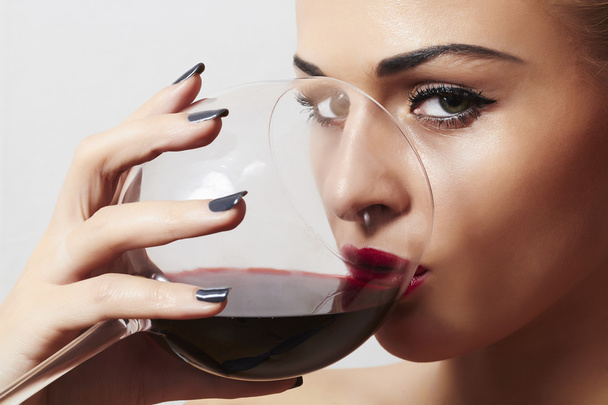 Beautiful blond woman drinking red wine.make-up.red lips - Foto, Imagem