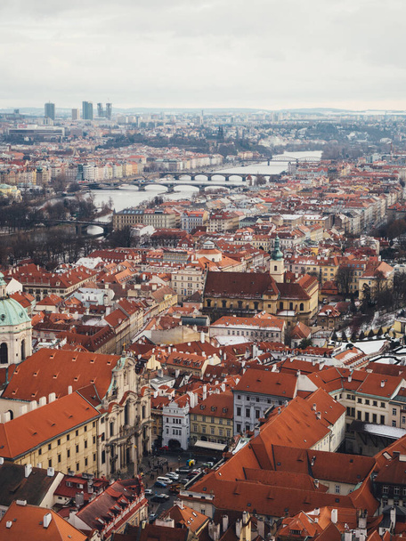 Red roofs of old medieval town in Prague. Winter - Foto, Bild