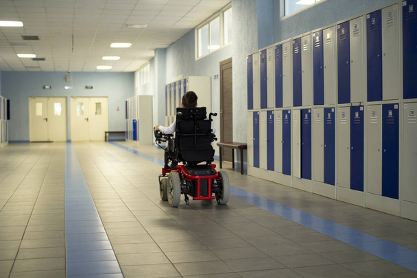 A disabled student in a wheelchair in primary school. - Photo, Image