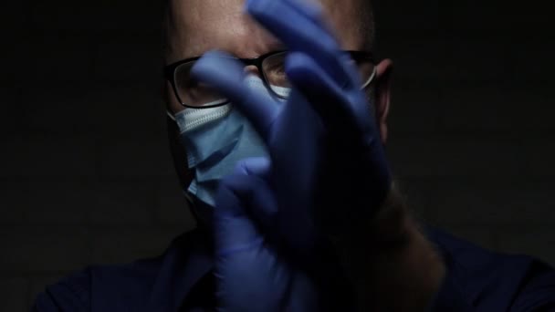 Slow Motion with Doctor Wearing Protective Face Mask and Gloves, Medical Person with Protection Equipment in a Quarantined Hospital Against Virus Epidemic - Materiał filmowy, wideo