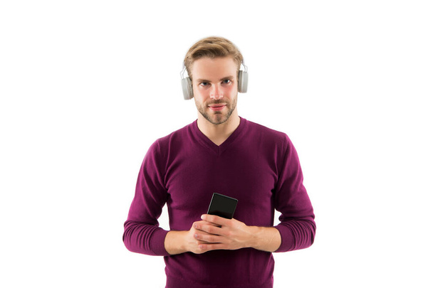 change musical track on mobile phone. confident guy open playlist on mp3 player. charismatic music lover. handsome unshaven man isolated on white. man listen music in earphones - Fotoğraf, Görsel