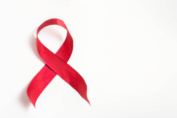 Red ribbon on a white background, December 1 world AIDS day - Fotó, kép