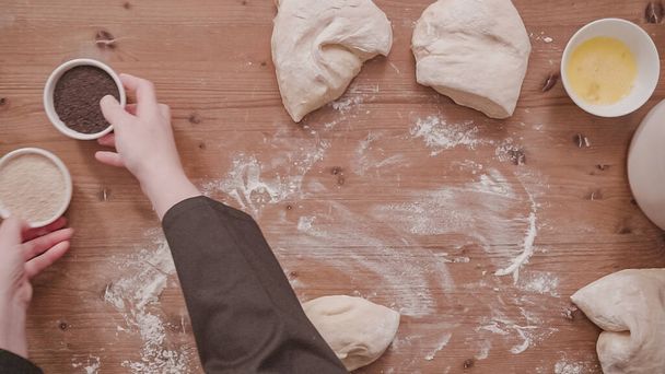Flat lay. Step by step. Rolling dough into even parts to bake challah bread. - Photo, Image