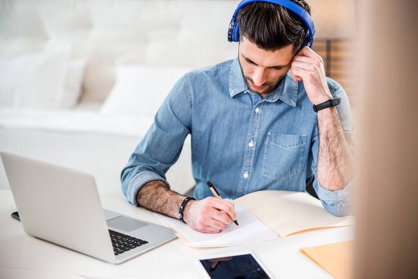 Freelancer is working from bedroom stock photo - Photo, Image