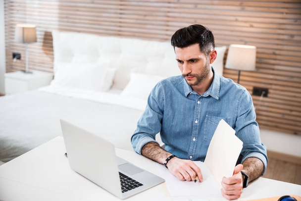 Man working with laptop at home stock photo - Foto, immagini