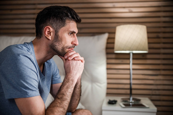 Handsome man in bedroom at home stock photo - Foto, immagini
