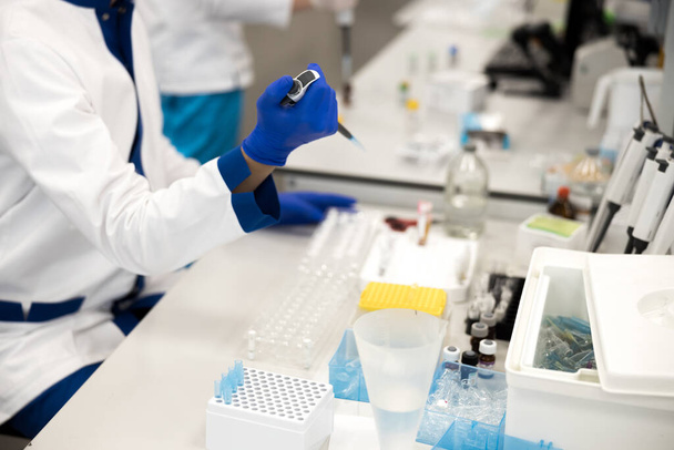 Male scientist doing biochemical blood test in laboratory - Zdjęcie, obraz