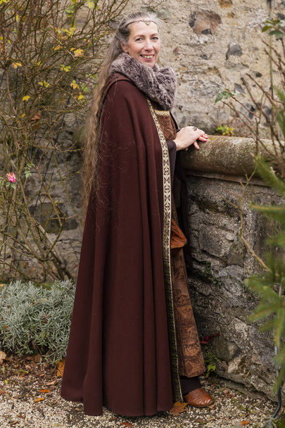 Robed long hair lady in medieval clothing - Photo, Image