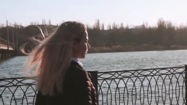 Beautiful Young Woman Walking On River Embankment In The City at Sunny Day. - Video