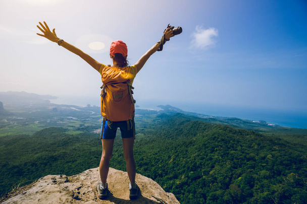 Successful woman outstretched arms on mountian top - Photo, image