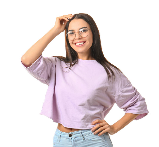 Young woman with stylish eyeglasses on white background - Foto, afbeelding