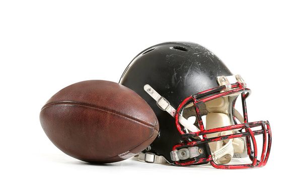 Helmet of American football player and ball on white background - Valokuva, kuva