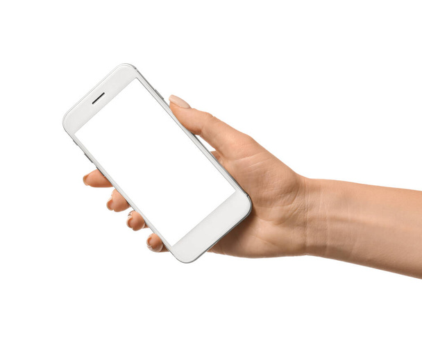Female hand with mobile phone on white background - Foto, afbeelding