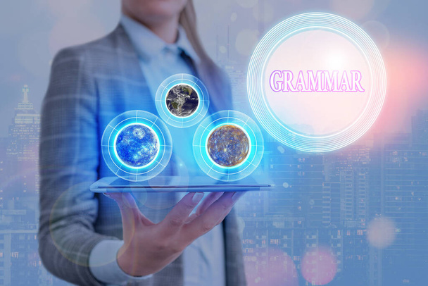 Conceptual hand writing showing Grammar. Business photo showcasing whole system structure language syntax and morphology Elements of this image furnished by NASA. - Photo, Image