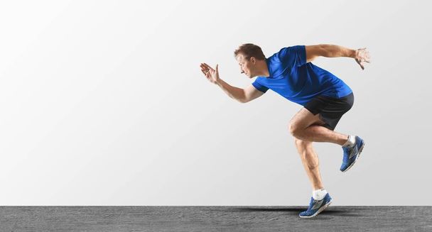 young man in sportswear running - Фото, зображення