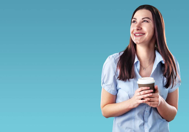 young woman holding cup of coffee - Φωτογραφία, εικόνα