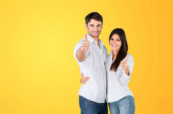 young couple in love on yellow background - Foto, Imagem