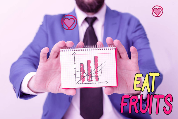 Handwriting text writing Eat Fruits. Concept meaning consume any product of plant growth useful to humans or animals. - Photo, Image
