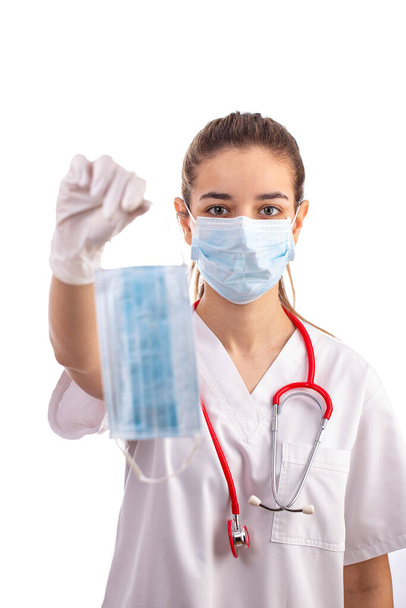 Young female doctor with face mask - 写真・画像