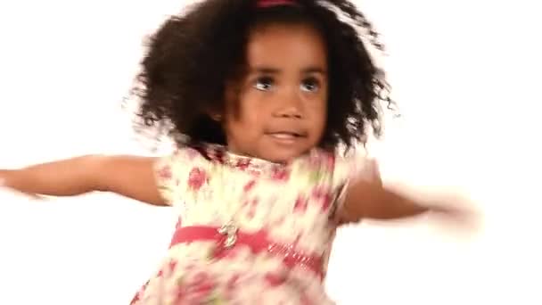 Funny mixed race black and latino brazilian little girl isolated dancing - Кадри, відео