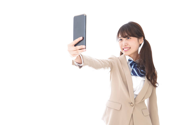 asian businesswoman taking selfie isolated on white background - Foto, Bild