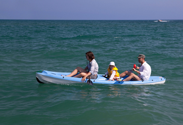 Family canoeing in the sea. - Photo, Image