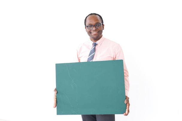 African businessman holding blank billboard isolated on white background - Photo, Image