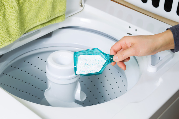 Putting Soap into washing machine - Photo, Image