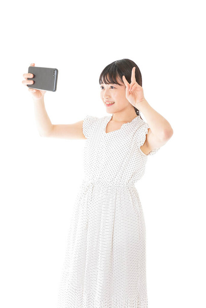 asian woman taking selfie with mobile phone   - Фото, изображение