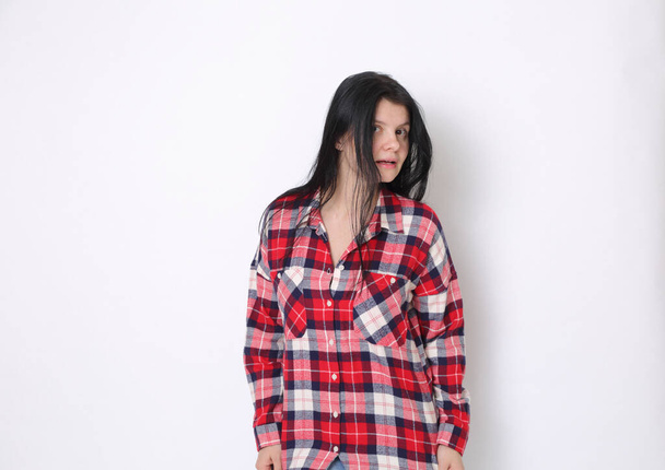 Attractive caucasian American woman in a red plaid shirt (Western style)  - Foto, imagen