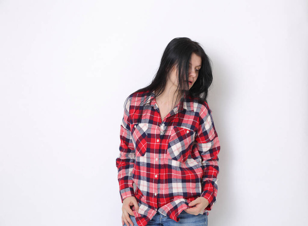 Attractive caucasian American woman in a red plaid shirt (Western style)  - Fotografie, Obrázek
