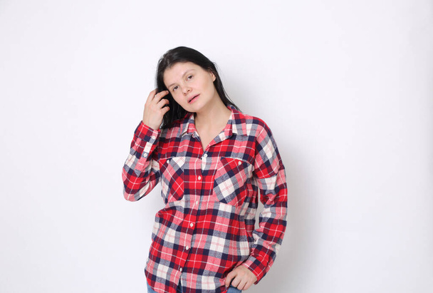 Attractive caucasian American woman in a red plaid shirt (Western style)  - Foto, Imagen