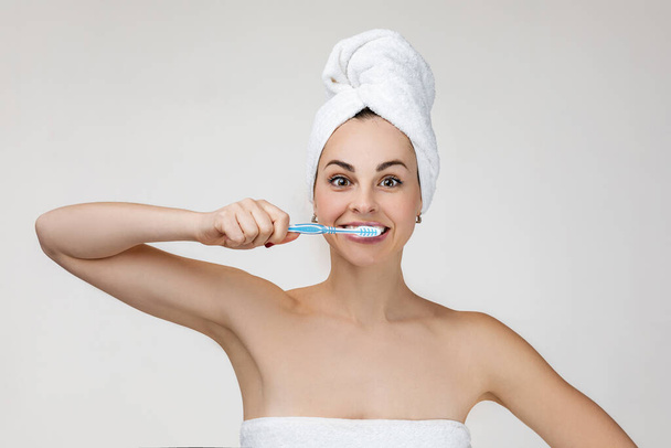 Happy young woman brush her teeth. - Фото, зображення