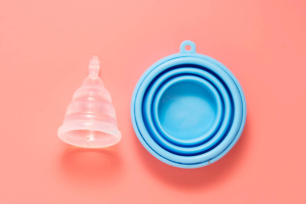 Menstrual cup isolated on pink background. Feminine health care, reusable feminine hygiene product. - Valokuva, kuva
