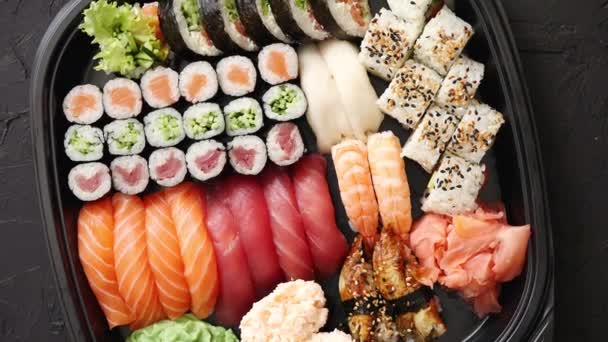 Various kinds of sushi on plate or platter set - Footage, Video