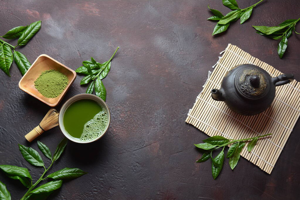 Green matcha tea drink and tea accessories on white background. Japanese tea ceremony concept. Detox tea. Antioxidant drink - Fotó, kép
