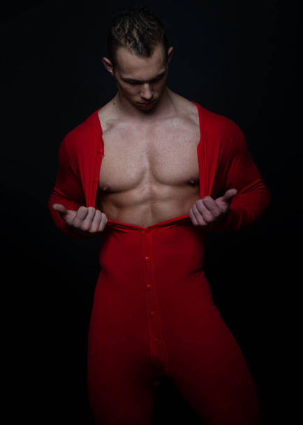 athletic male model in red pajama - Photo, Image