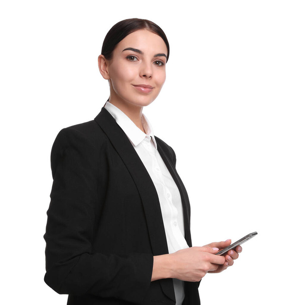 Young businesswoman with mobile phone on white background - Foto, imagen