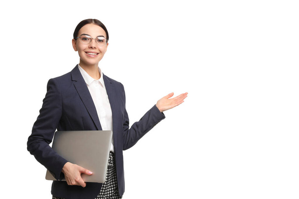 Young businesswoman with laptop on white background - Φωτογραφία, εικόνα