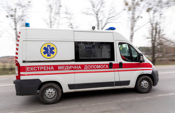 Ukrainian ambulance car on emergency in action. Motion blur - Φωτογραφία, εικόνα