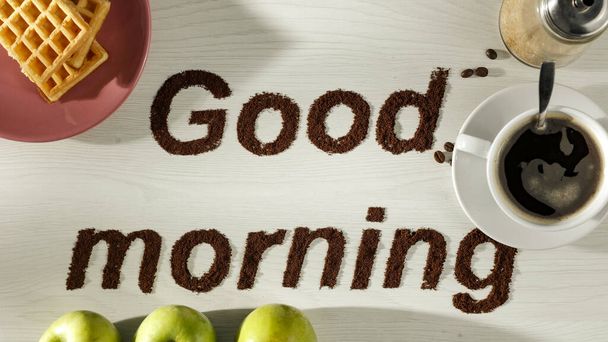 Good morning coffee grain beans inscription with bright table background. Copy space for advertising products and decoration. - Foto, imagen